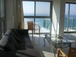 Living room with magnifical sea view of holidays apartment rental in marina of herzliya in Israel